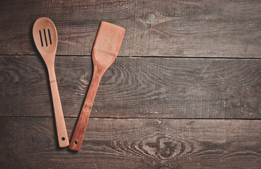 Wooden spoon for cooking on the table.
