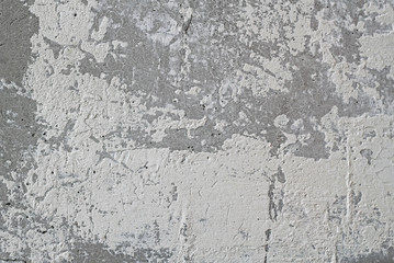 texture of cracked white color paint on stone old wall abstract background. template for design
