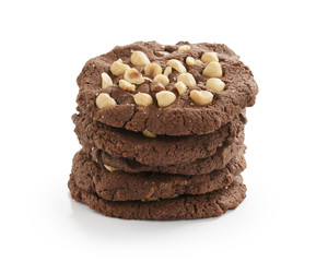 stack of homemade chocolate cookies with hazelnuts isolated on white background