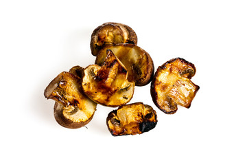 fried mushrooms on a grill on a white background for isolation