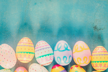 Colorful easter egg on blue pastel color wood background