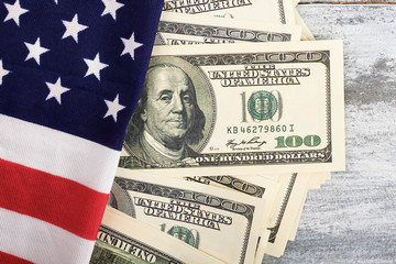 Money and flag of America. National stability and independence.