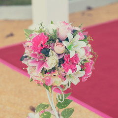Colorful decoration artificial flower with vintage toned.