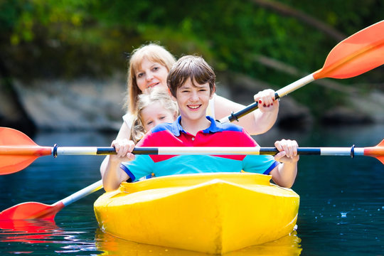 Family enjoying kayak ride on a river