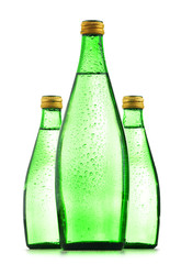 Glass bottles of mineral water isolated on white