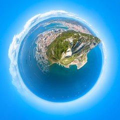 Fototapeta premium Little planet composition of an aerial view of the top of Gibraltar Rock, located in the Upper Rock Natural Reserve. United Kingdom, South West Europe. Globe concept, ecosystem, earth.