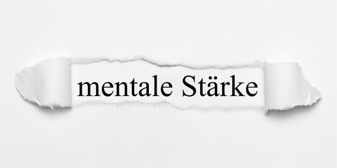 mentale Stärke auf weißen gerissenen Papier