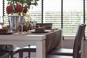 Modern classic dining set on wooden table with natural lighting
