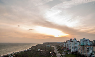 Peaceful sunset in the city near sea