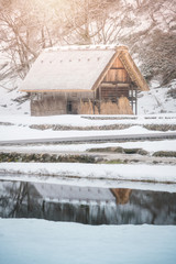 Thatch roof traditional style house with sun light, Historic village Shirakawago in winter season, Japan
