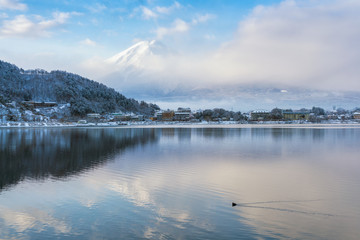 Mountain Fuji and Kawaguchiko lake with morning mist in winter season