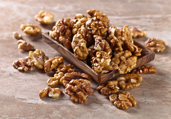 Walnuts in old wooden dish