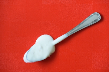 spoon on red background