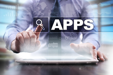 Businessman using tablet pc and selecting apps.