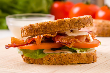bacon sandwich on wooden table