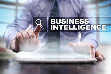 Fototapeta na wymiar Businessman using tablet pc and selecting business intelligence.