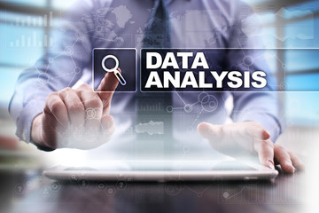 Businessman using tablet pc and selecting data analysis.