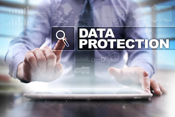 Businessman using tablet pc and selecting data protection.