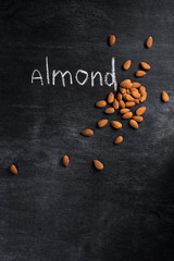 Almond over dark chalkboard background