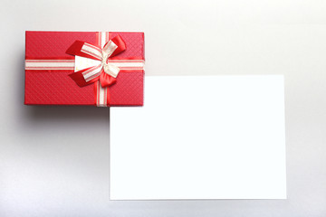 Beautiful gold, red present gift box and ribbons on backgound