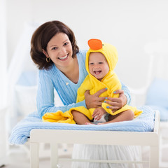 Mother and baby in towel after bath