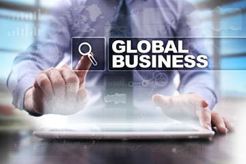 Fototapeta na wymiar Businessman using tablet pc and selecting global business.