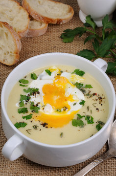 potato cream soup with poached eggs