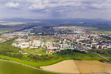 Fototapeta na wymiar Aerial view of Topolcany, Slovakia, Slovak city Topolcany from plane