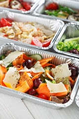 Healthy food take away, top view at wood background