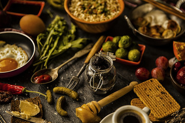 Table with food in breakfast or lunch: omelette, cabbage, oil, c