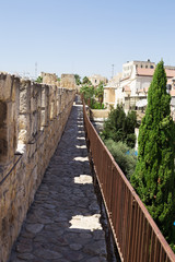 Fototapeta na wymiar The passage along the wall which surrounds the Old City of Jerus