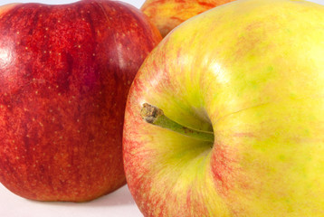 Juicy red and yellow apple closeup. On white background