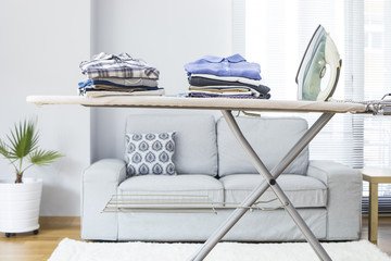 Ironing clothes on ironing board