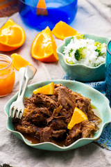 Slow Cooker Braised Pork with a Rum-Orange Sauce.