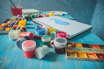 Paper, watercolors, paint brush and some art stuff