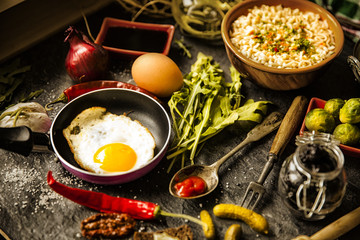 Table with food in breakfast or lunch: omelette, cabbage, oil, c