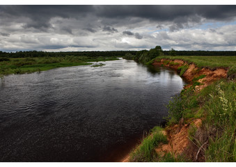 The view of the valley and the valley of the river Mologa from the high Bank.