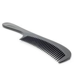 Black hairbrush on a white background.Isolated