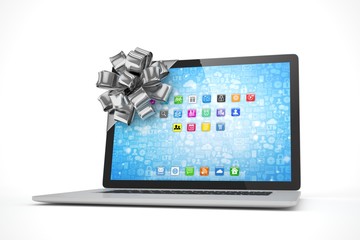 Tied laptop with silver bow on white background. Modern present or gift for birthday, holiday, christmas. 3D rendering.