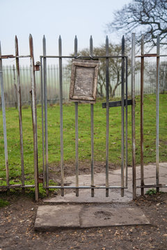 Old Iron Gate with Empty Sign