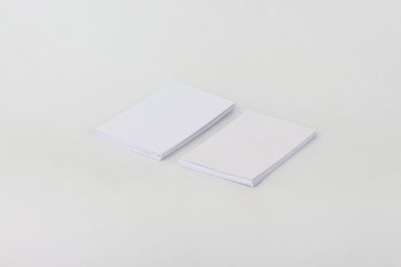 White business card on a white background.