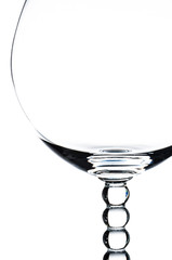 A Part Of Glass Of Wine Over White Background.