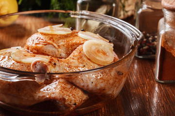 Raw chicken legs marinated