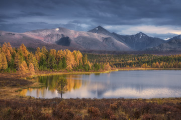 Mirror Surface Lake Beautiful Autumn Landscape With Snowy Mountain Range On Background