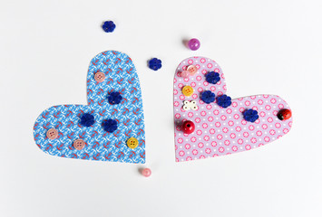 Hearts made of paper and beads.