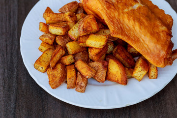 Grilled chicken wings served with french fries and lettuce