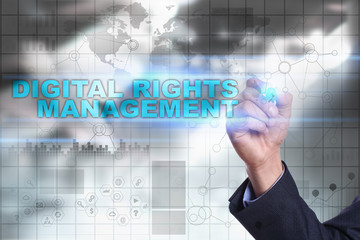 Businessman is drawing on virtual screen. digital rights management concept.