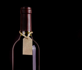 Bottle of red wine with tag