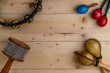 Flat lay of Latin percussion on wood desk