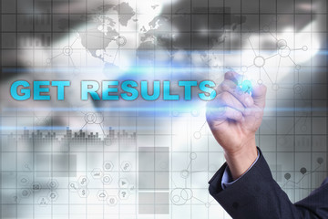 Businessman is drawing on virtual screen. get results concept.